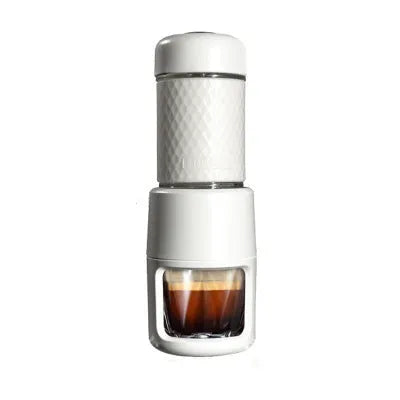 Portable manual espresso coffee machine in four colours with compact stainless steel design.