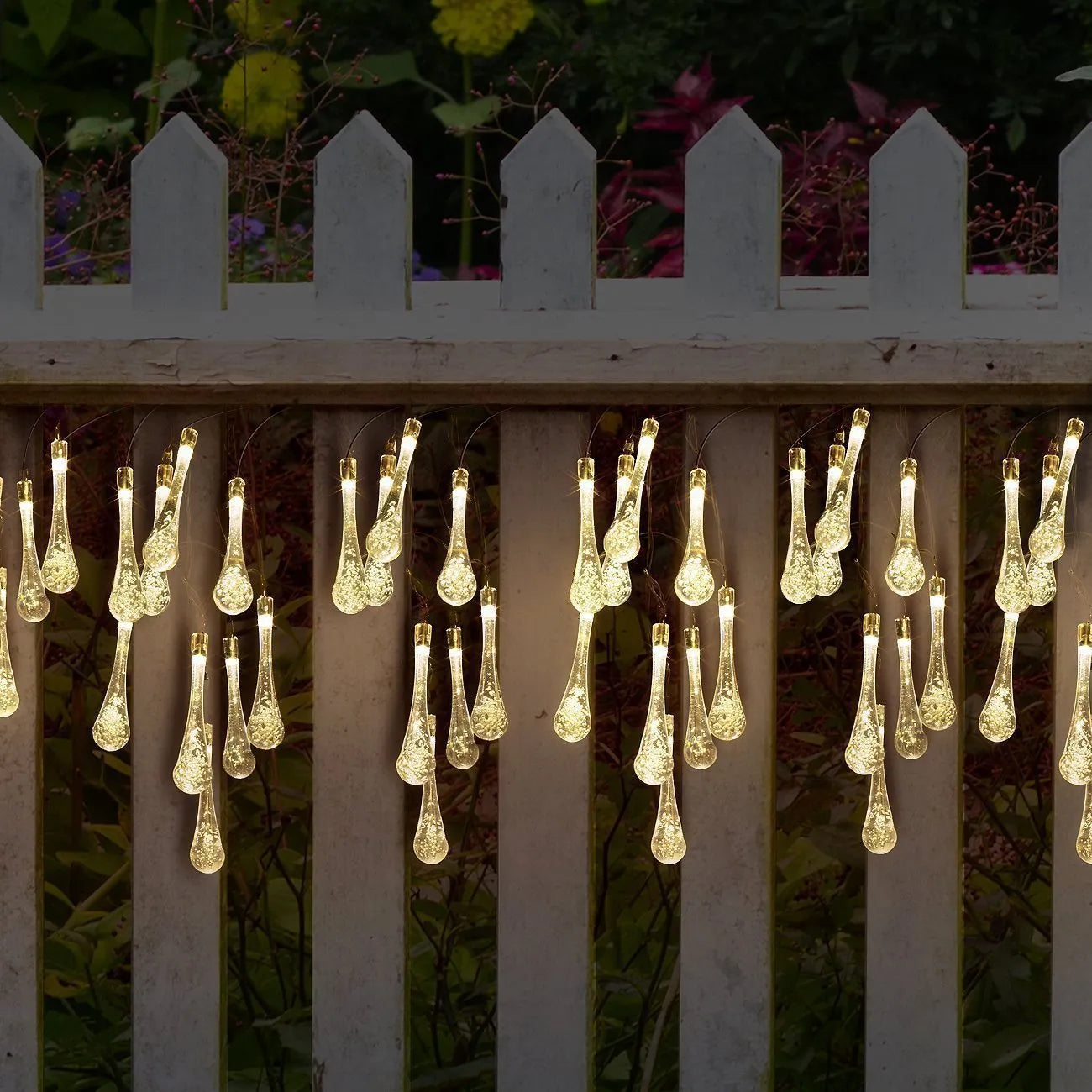 Solar-powered LED outdoor string lights with water drop-shaped pendants on a 6.5m cable
