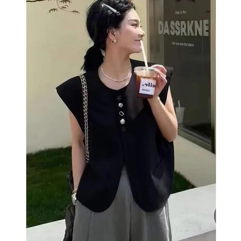Women's loose fit polyester vest in short length with pockets, shown in milk white colour