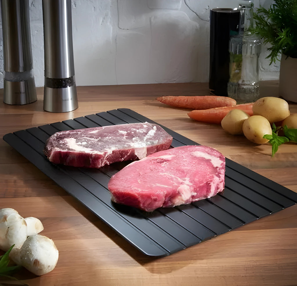 Black aluminium quick defrosting tray for thawing meat and frozen food without electricity.