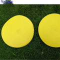 23cm diameter football training landmark pad in bright colours on grass field