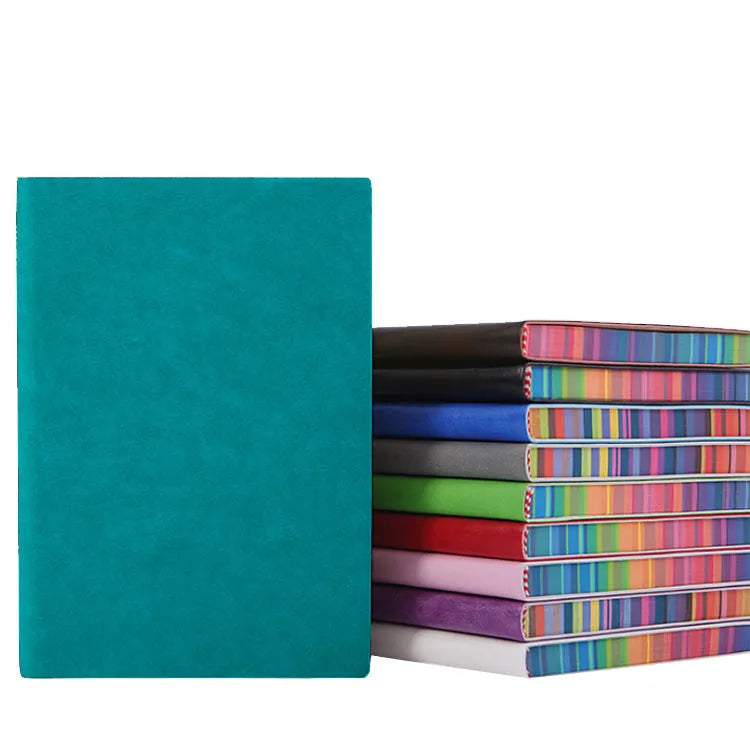 A5 rainbow side PU leather cover notebook open on a desk, showing lock line hardcover binding and 100g Daolin paper pages