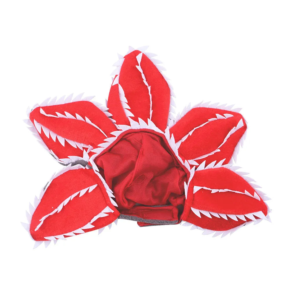 Dog wearing Halloween chomper demon costume with scary headband and flower details