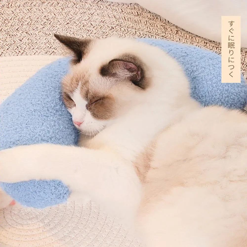 U-shaped blue cat pillow with an adjustable collar, shown on a cat bed.
