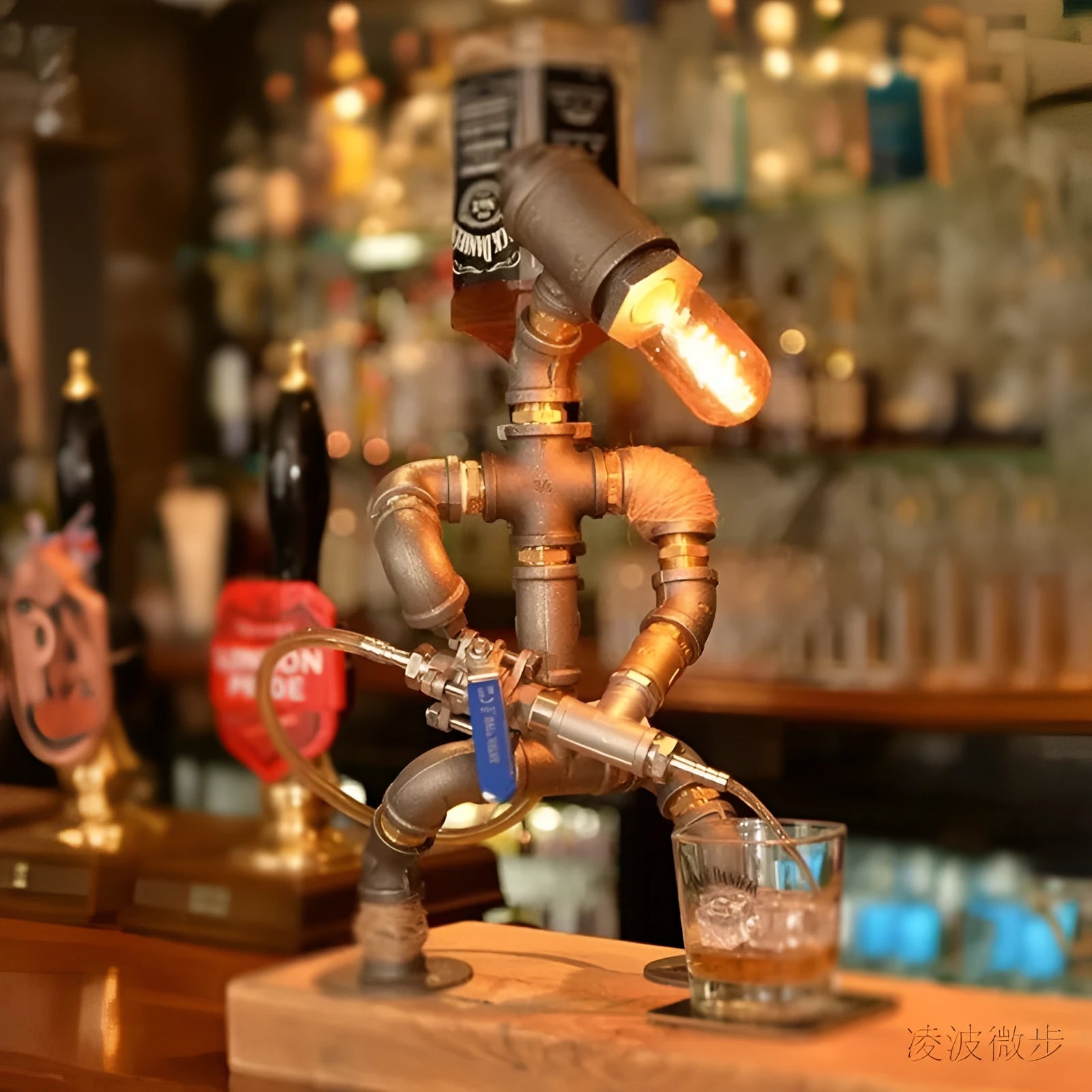 Custom industrial retro style iron pipe robot table lamp on a wooden desk.