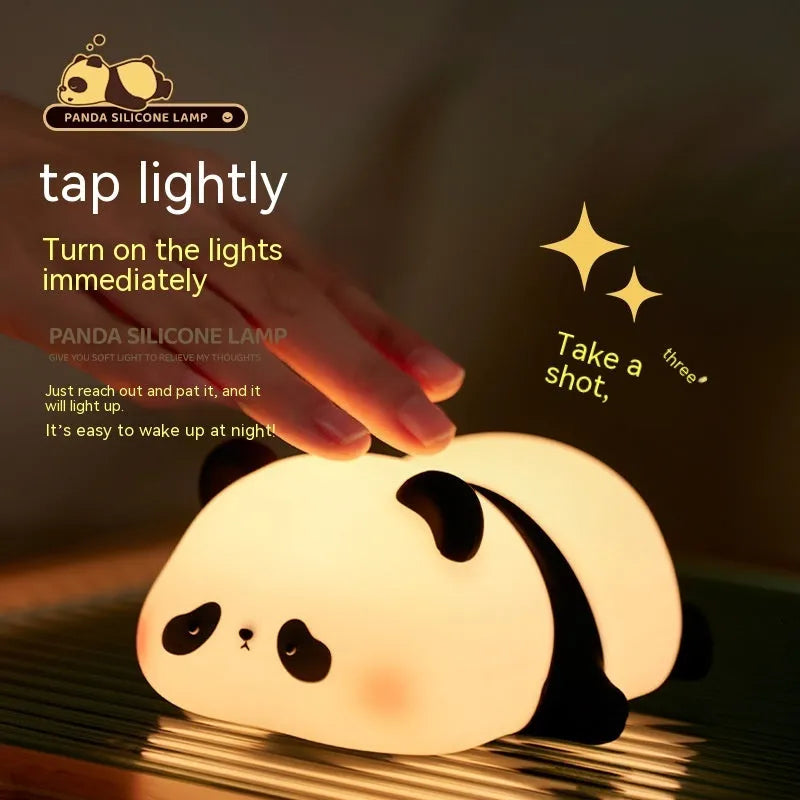 Panda-shaped silicone night light for kids on a bedside table