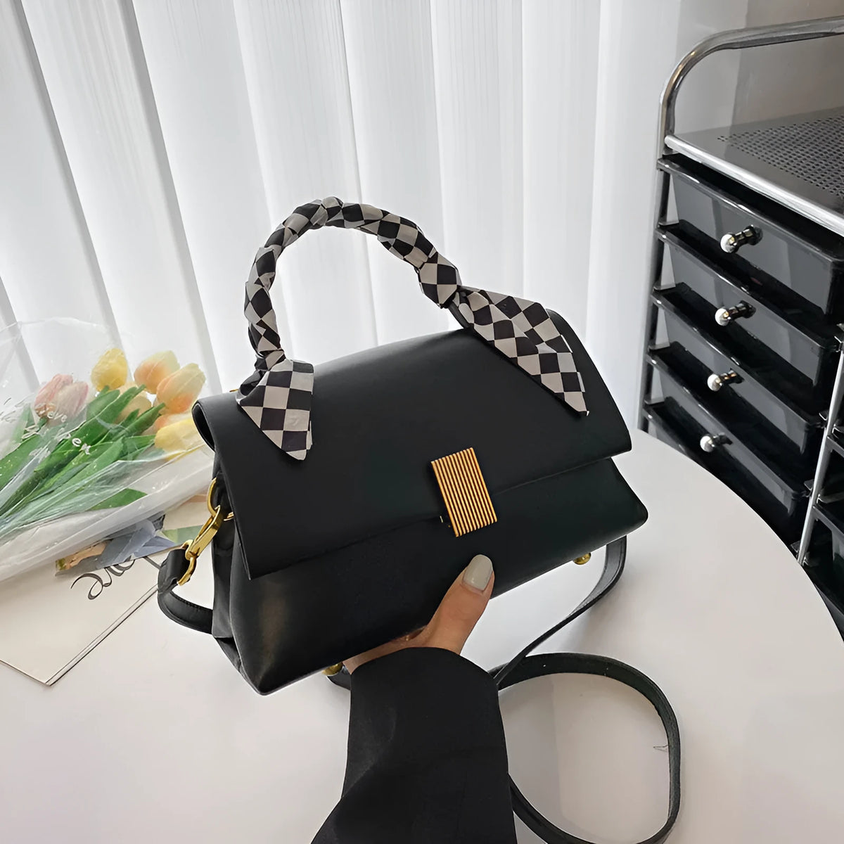 Medium-hardness PU shoulder handbag in horizontal square shape with visible sewing thread detail, black colour option