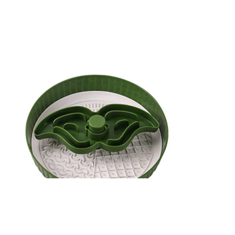 Slow feeder dog bowl with rotating game board and textured silicone licking mat insert.