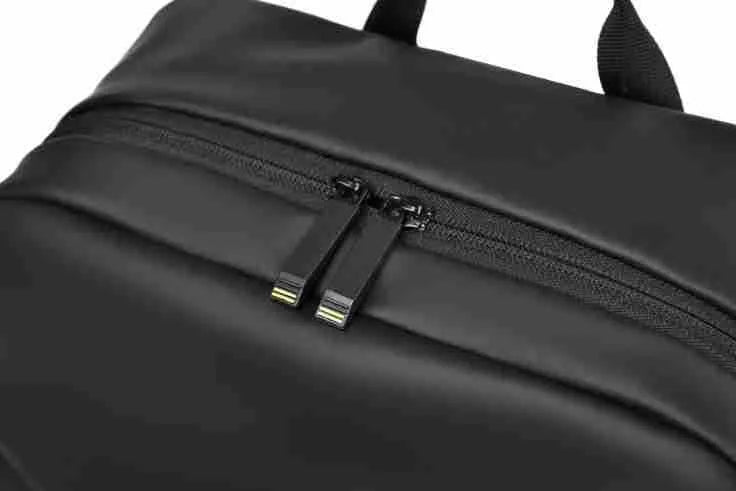 Men's waterproof backpack in black, blue or grey colour with PU leather construction and sewing thread detailing