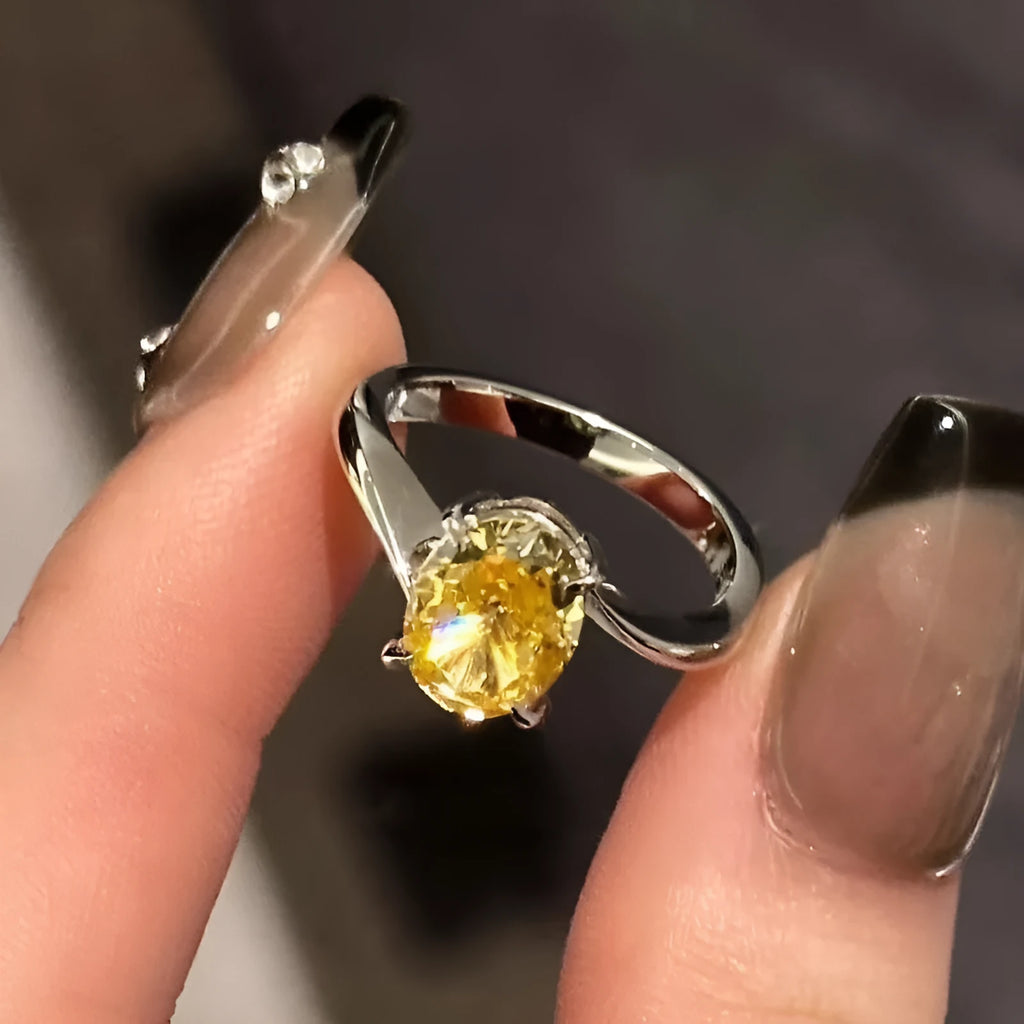 Women's yellow rock sugar copper ring on a neutral background showing bright yellow finish