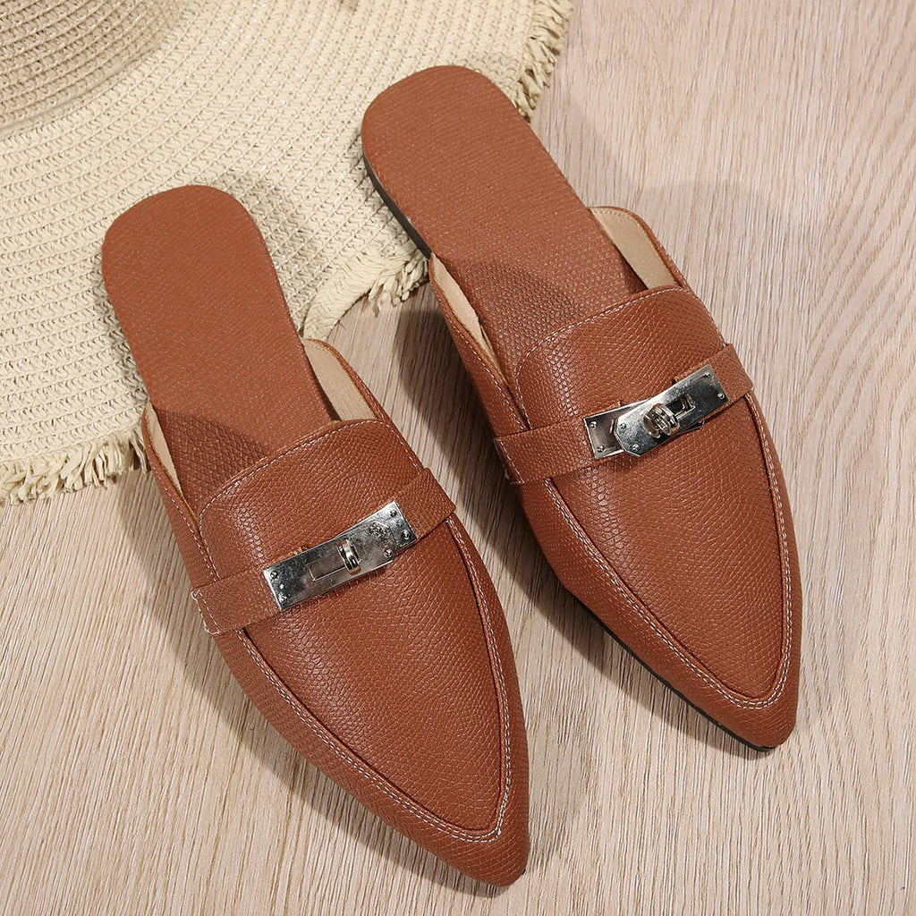 Light brown women's pointed toe slippers with a low heel, showing PU upper and rubber sole.