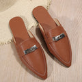 Light brown women's pointed toe slippers with a low heel, showing PU upper and rubber sole.