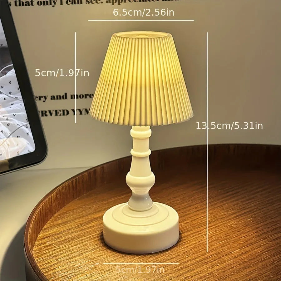 Battery-powered decorative table lamp with LED light, white pleated shade