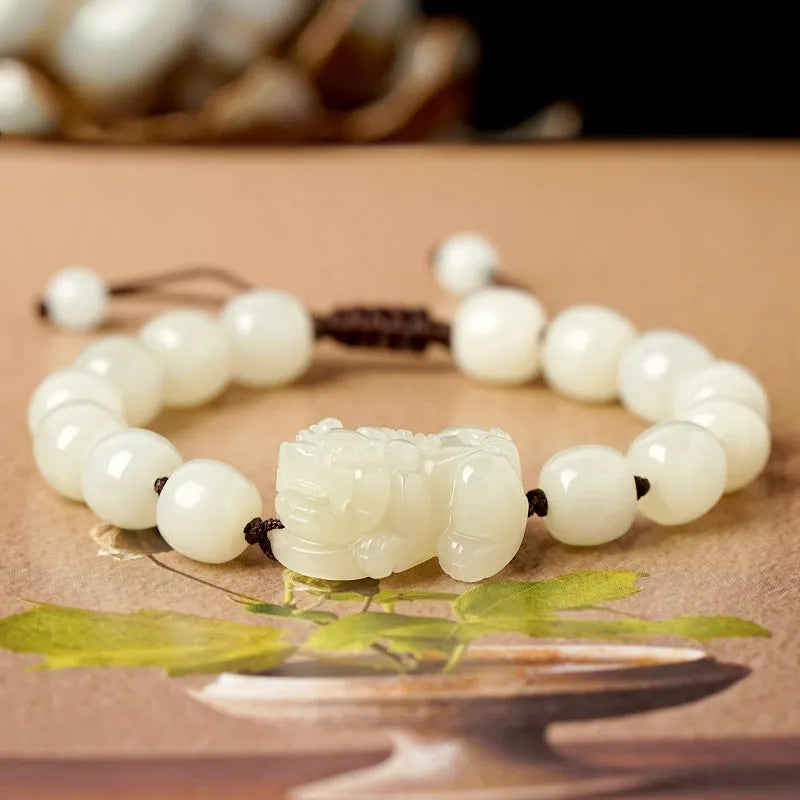 Traditional Chinese Hetian jade bracelet with black and red braided ropes and jade beads on elastic cord