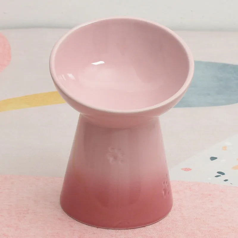 Black ceramic pet bowl with a high foot and neck protector to prevent tipping, shown with flat and slanted rim options.