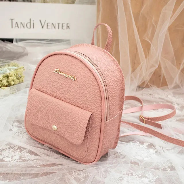 Fashion women's small backpack in solid colour with zip closure, PU material, 18.5cm tall