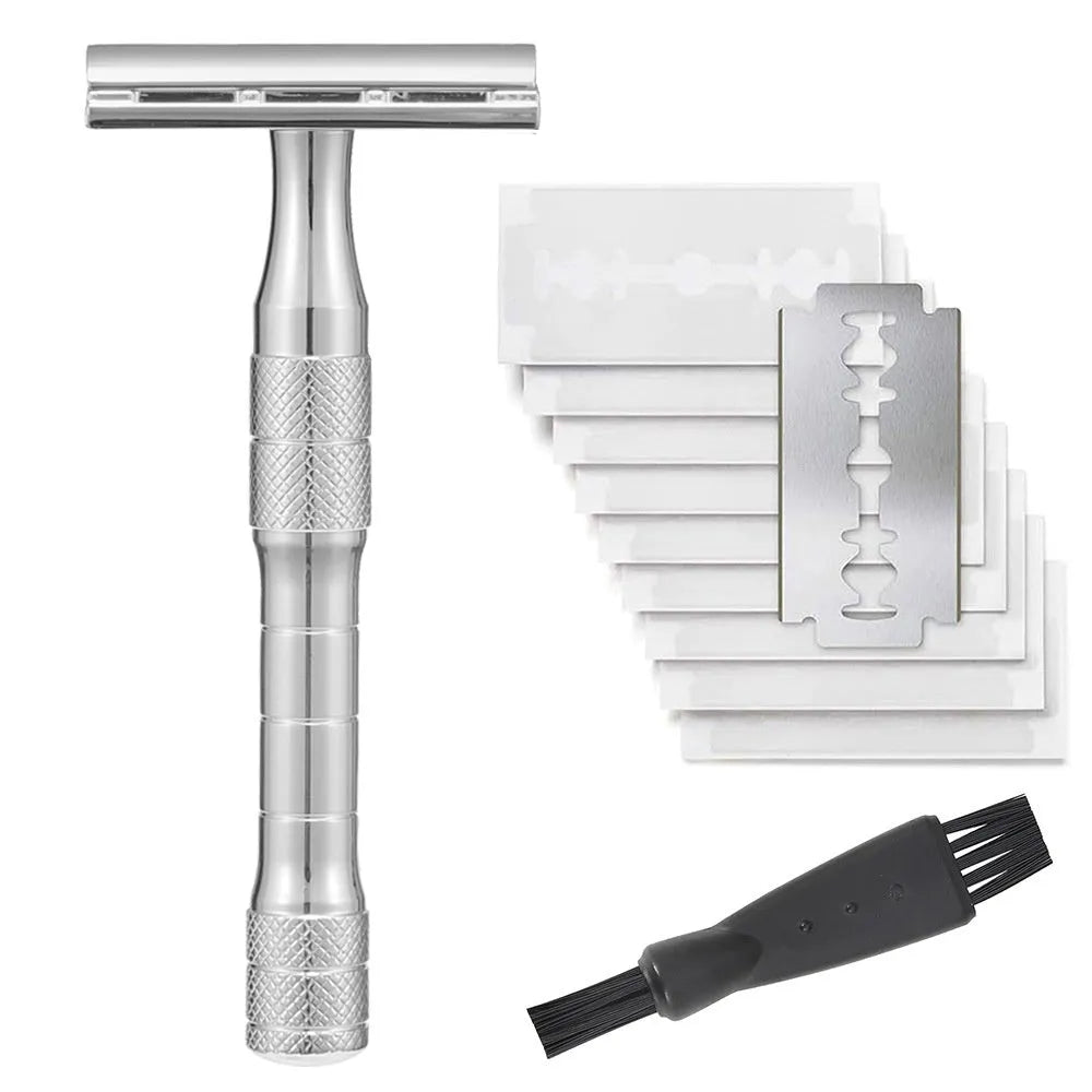 Manual double-sided safety razor with alloy handle, shown with replacement blades on a towel.