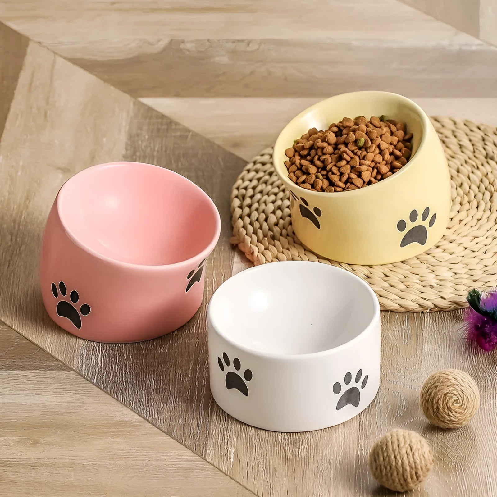 Ceramic cat bowl with high foot design in cat's paw pattern available in multiple colours