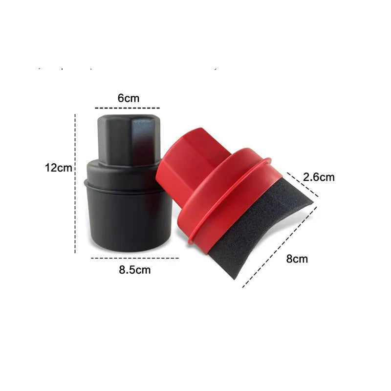 Black and red hand-held car tyre polishing sponge brushes with lids on a workbench.