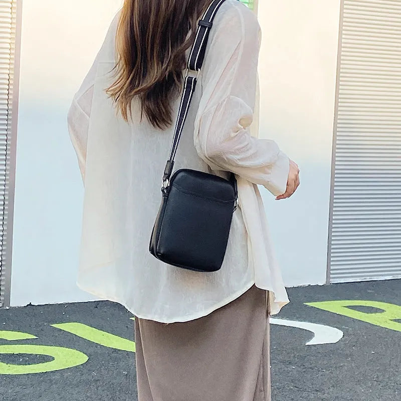 Solid colour mobile phone crossbody bag for women in black, beige, khaki, or green.