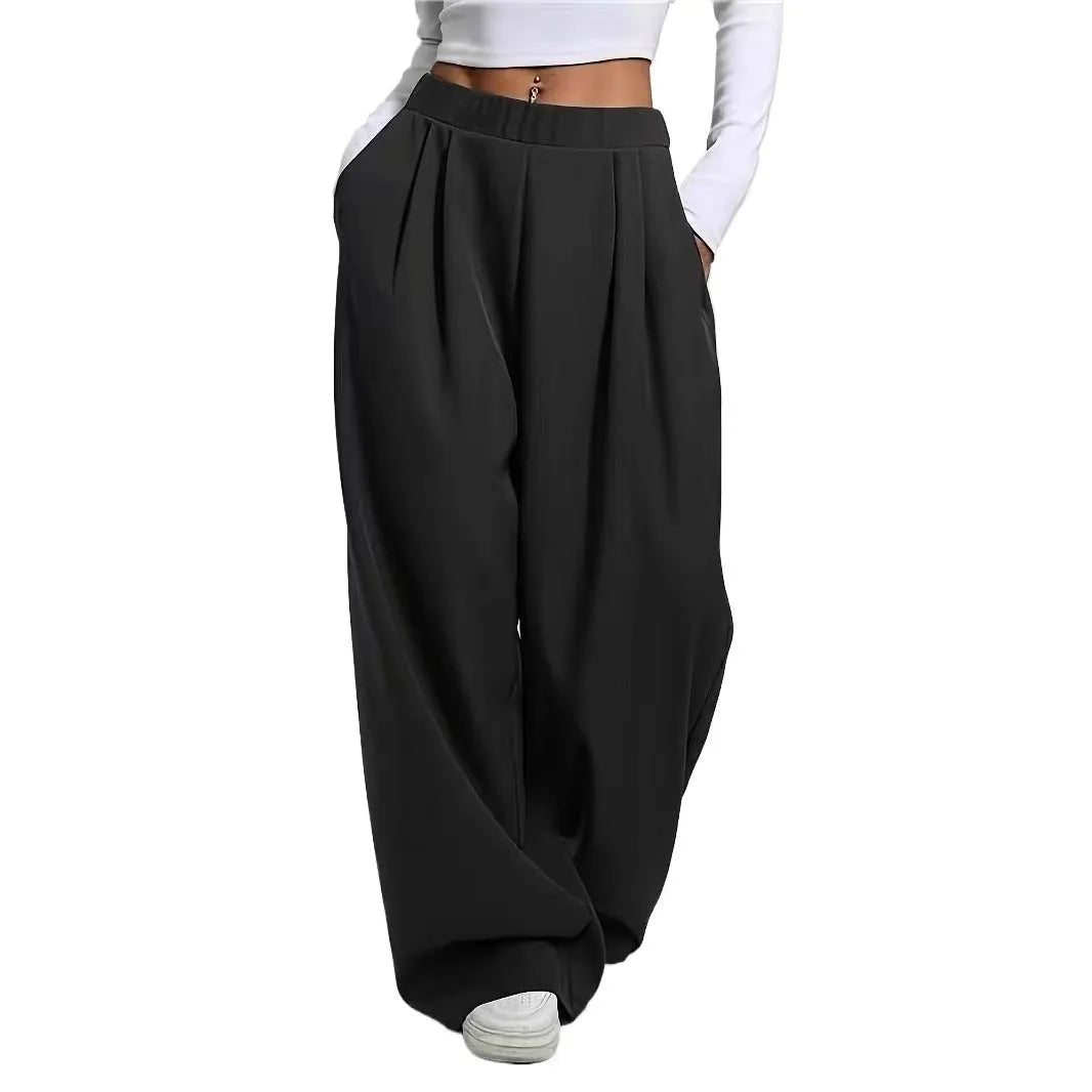 Women's high-waisted loose straight pants with pockets in black polyester fabric