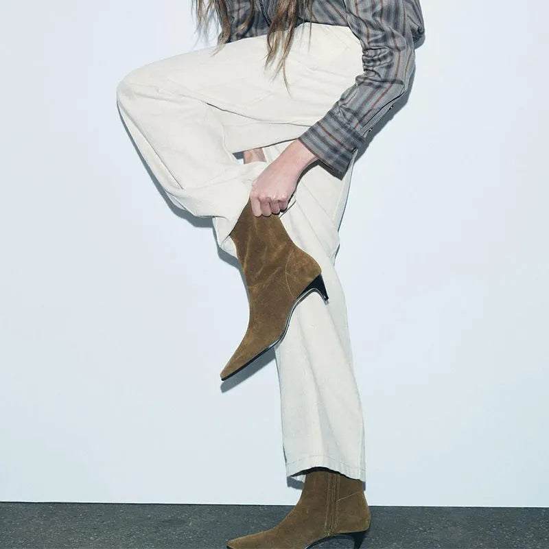 Brown square toe ankle boots with side zipper and kitten heels on a waterproof platform sole