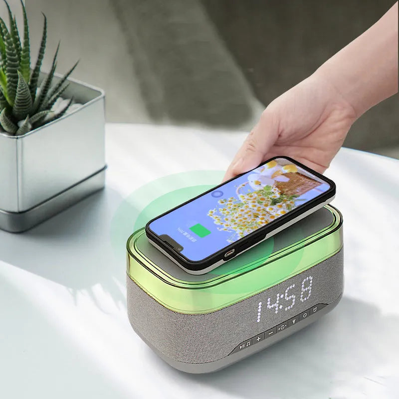 White multifunctional alarm clock with Bluetooth speaker and wireless charging pad display