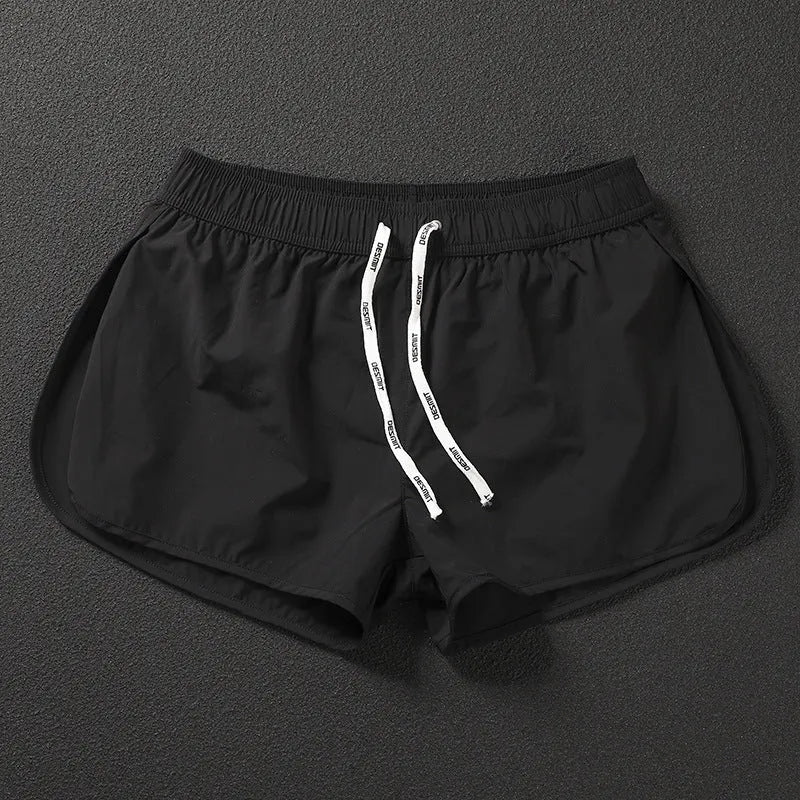 Men's loose fit elastic waist shorts in orange, green, or black for beach and surfing