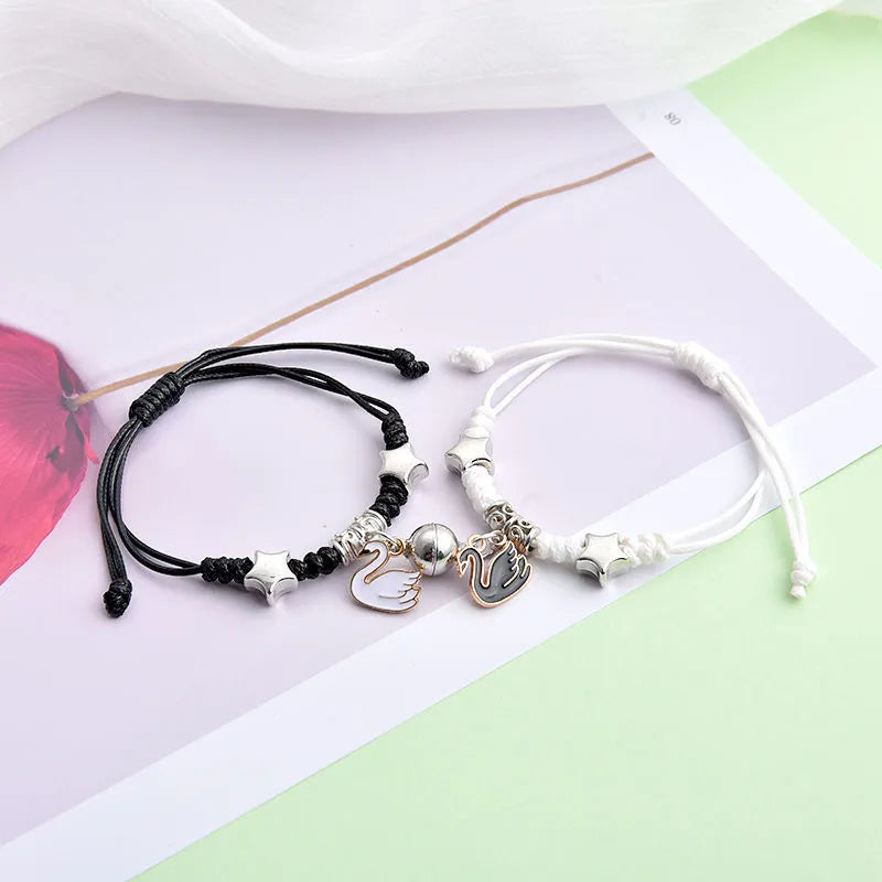 Magnet couple bracelets with electroplated finish showing magnetic clasp and symbolic design options