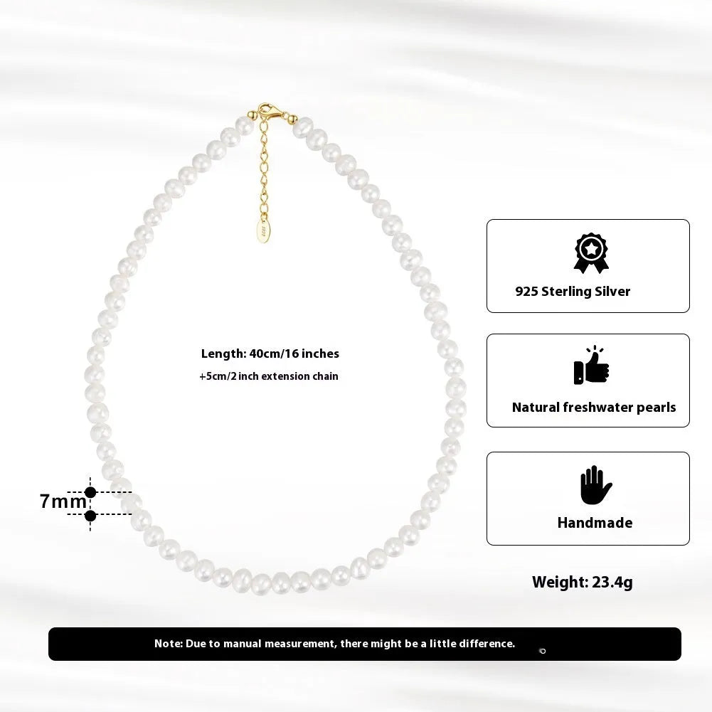 Close-up of a women's adjustable necklace with freshwater pearls on a sterling silver chain.