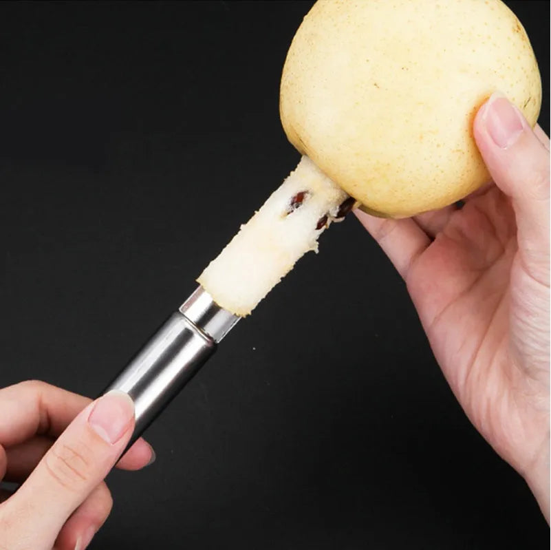 Stainless steel pineapple corer slicer with ABS handle on a kitchen worktop