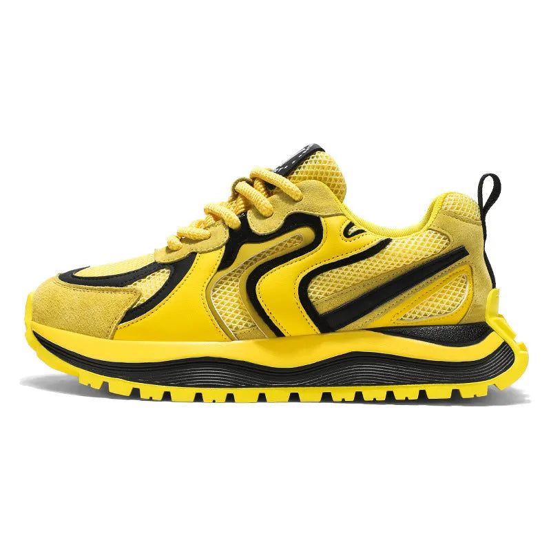 Men's yellow synthetic leather and mesh casual sneaker with rubber sole and lace-up front.