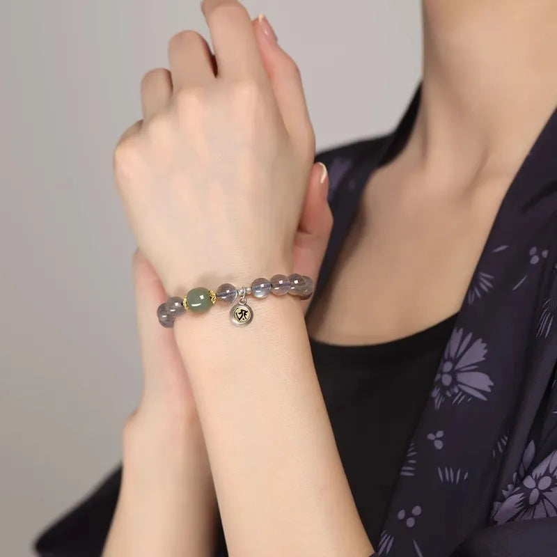 Moonstone crystal bracelet with 8mm beads showing Thousand-Hand Kwan-yin mouse design