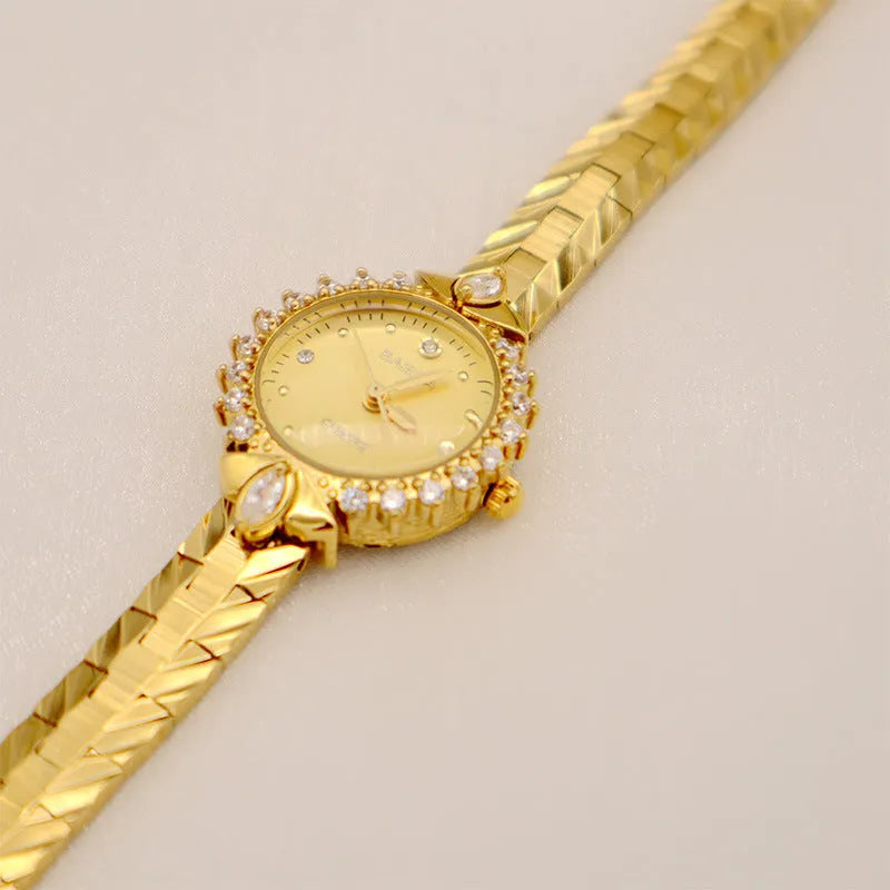 Women's quartz watch with diamond embossed bracelet in gold colour