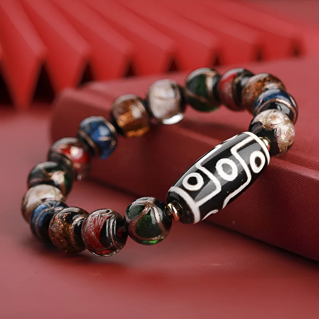 Chinese-style five-colour lucky snake bead bracelet made from coloured glaze, showing auspicious patterns.