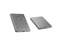 Magnetic wireless power bank with alloy shell in black, compact portable charger on a plain background