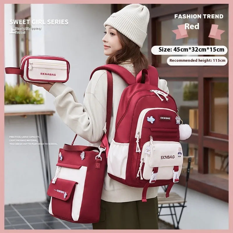 Girls' pink waterproof Oxford cloth school backpack with curved shoulder straps.