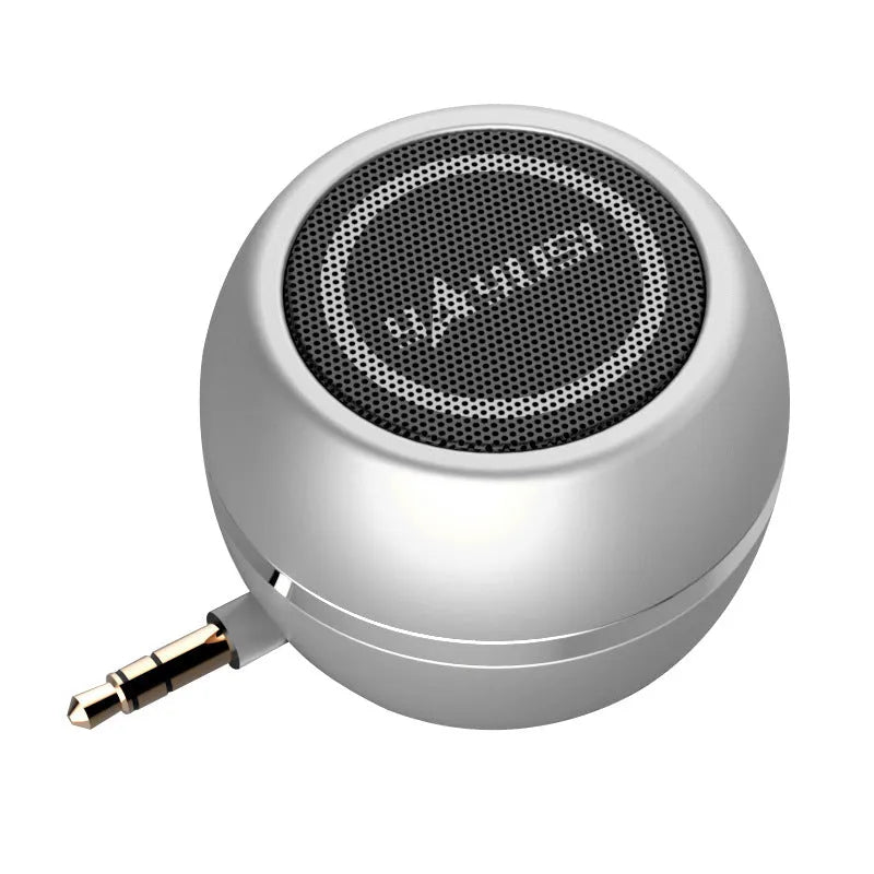 A5 portable mini speaker in red with 3.5mm audio plug and ABS plastic casing on a table