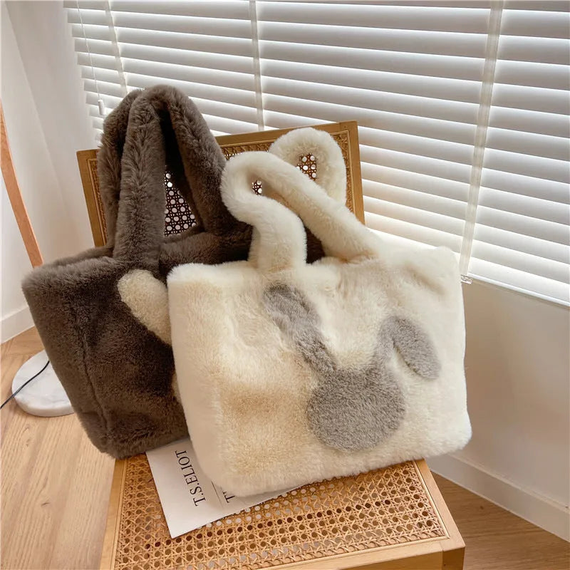 Soft beige plush tote bag with cartoon rabbit ears on the front, shown as a large capacity shoulder bag.