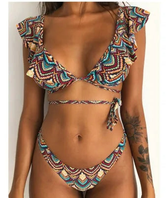Yellow floral print split bikini swimsuit set for surfing on mannequin