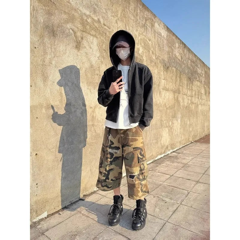 Men's camouflage cropped jeans with patch ripped detailing and loose straight-leg cut
