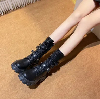 Women's black mid-calf knight boots with metal buckle detailing and side zipper