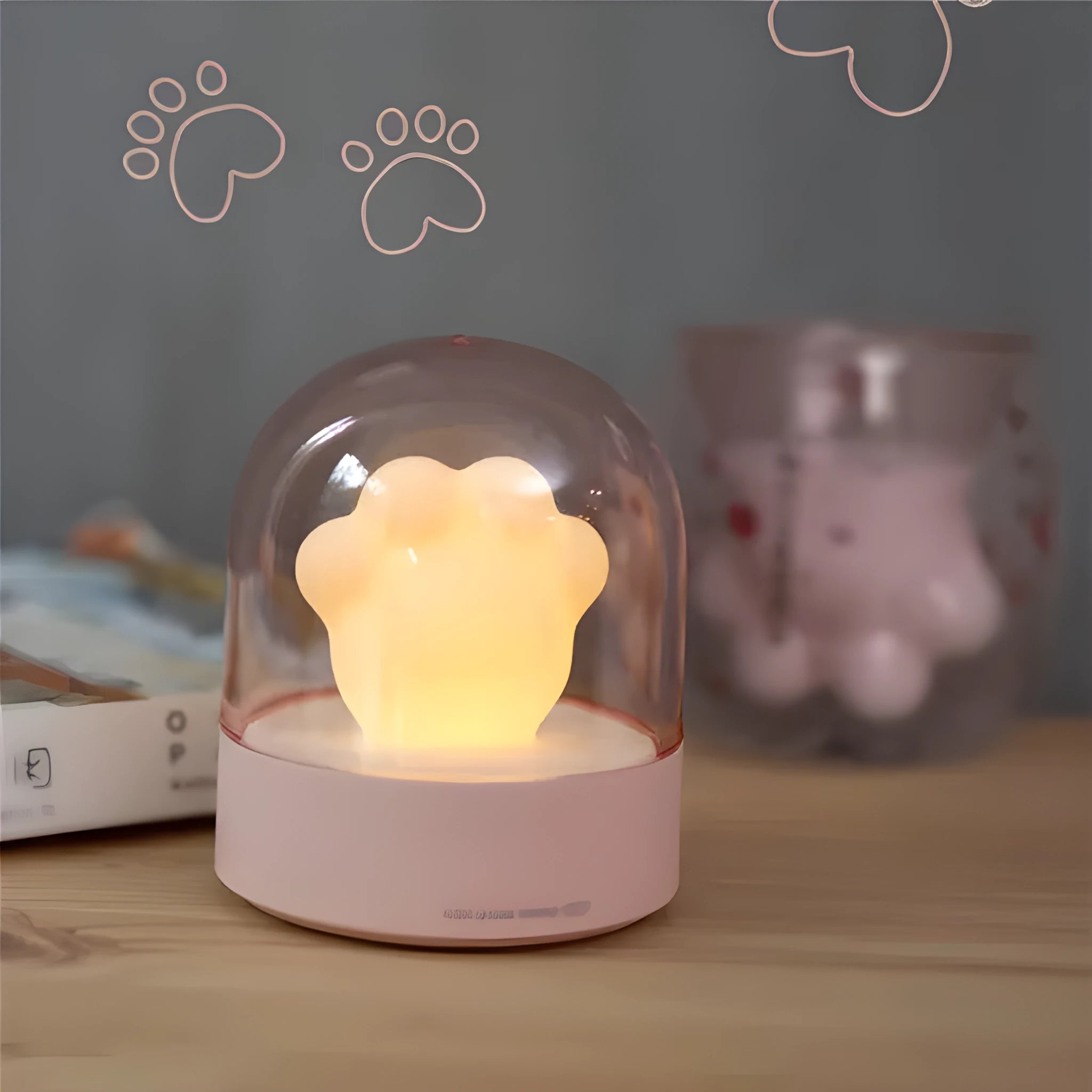 Grey cat paw shaped USB rechargeable night light with music box function on wooden desk