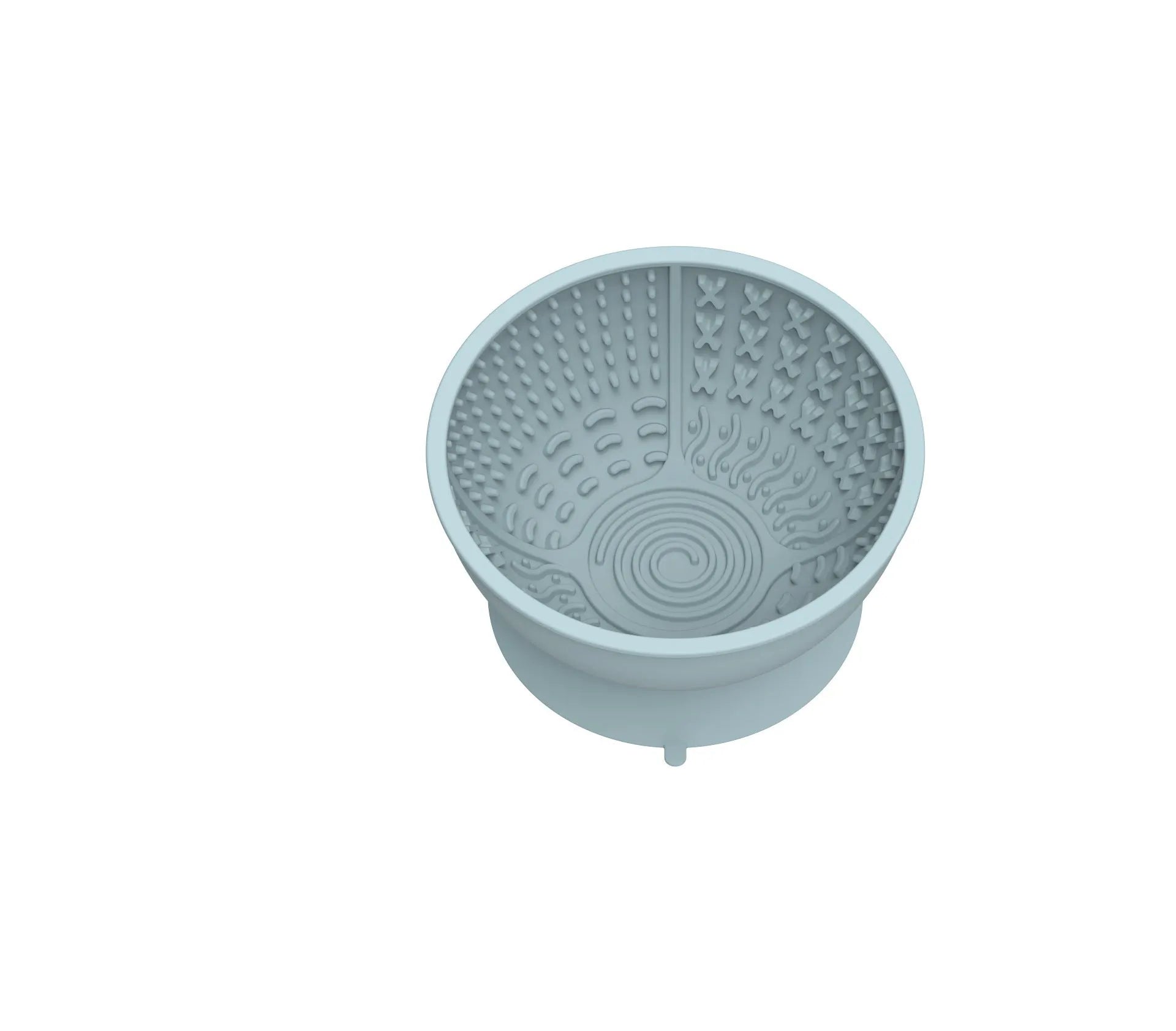 Cyan silicone dog bowl with textured slow feeder patterns and a suction cup base on a table.