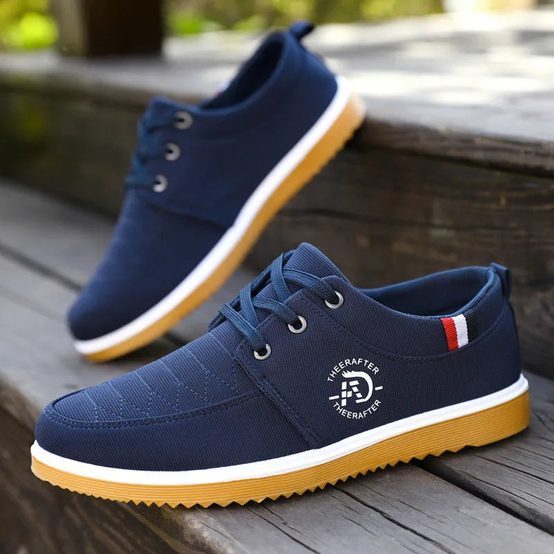 Men's black canvas casual shoes with a leather toe cap and platform sole.