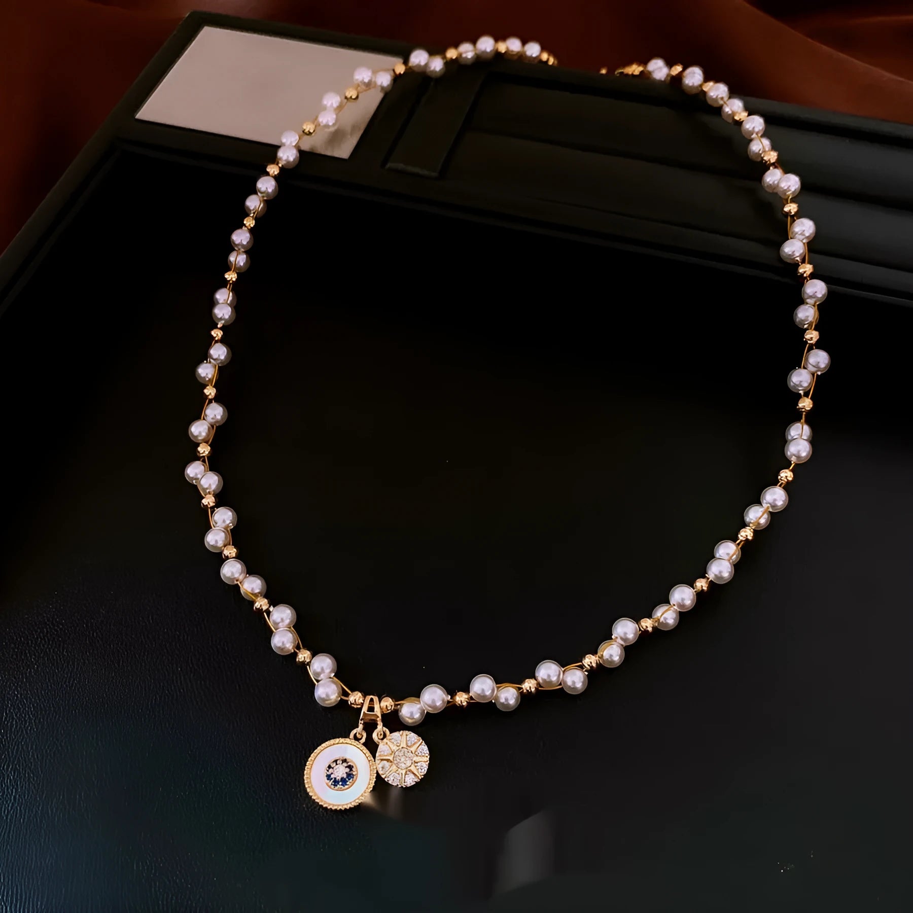 Gold electroplated zircon and imitation pearl pendant necklace on adjustable clavicle chain