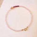 Handmade pink crystal bracelet with strawberry quartz beads and a zodiac animal charm