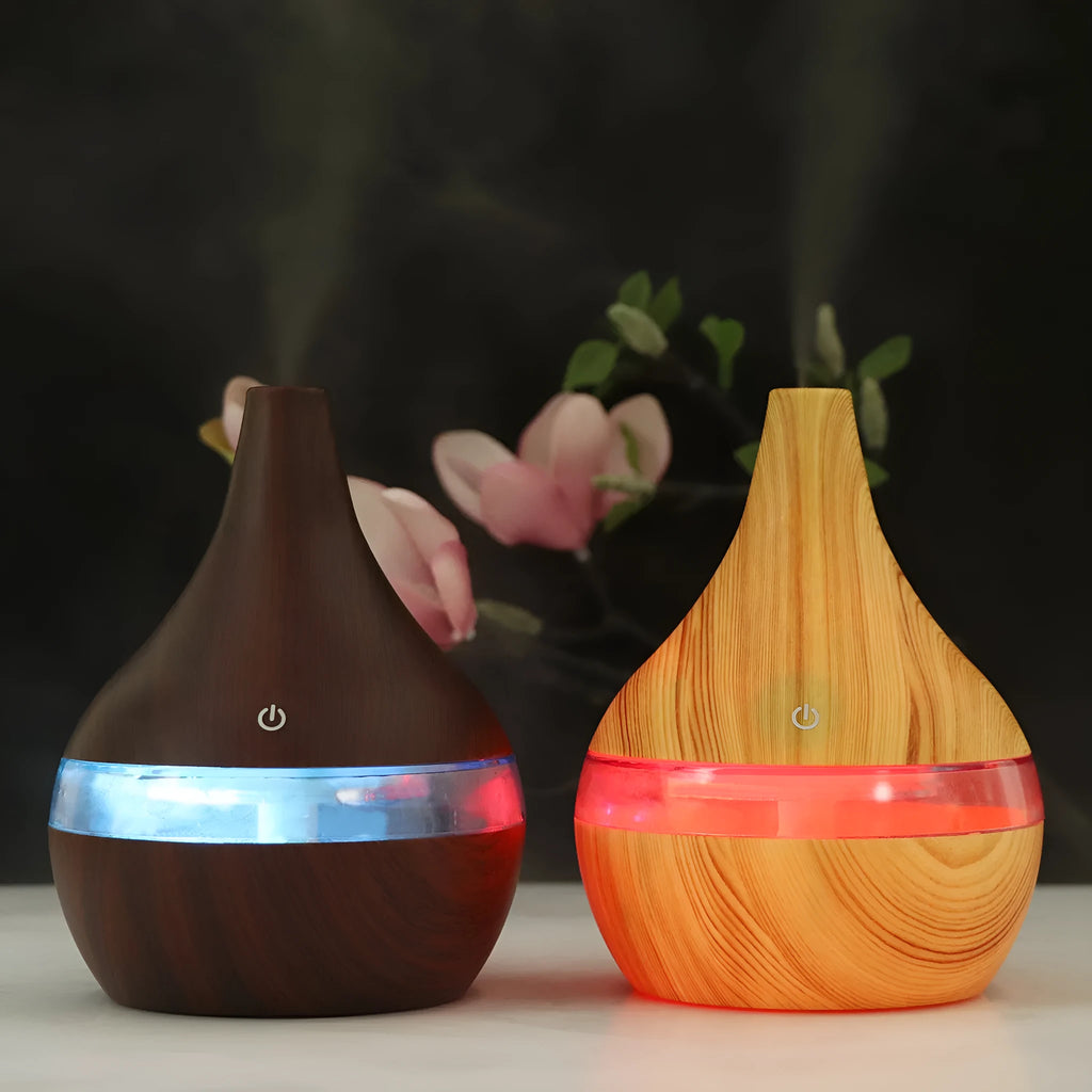 Columnar USB mini air purifier and humidifier in light wood grain finish on a desk.