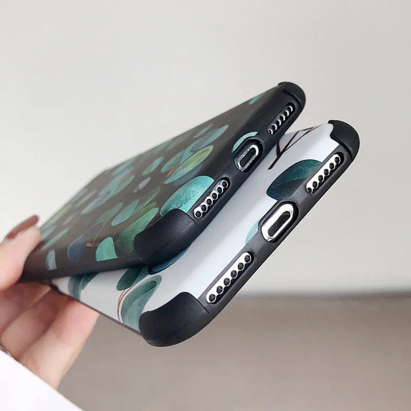 Black silicone iPhone case with leaf pattern texture and raised camera protection rim