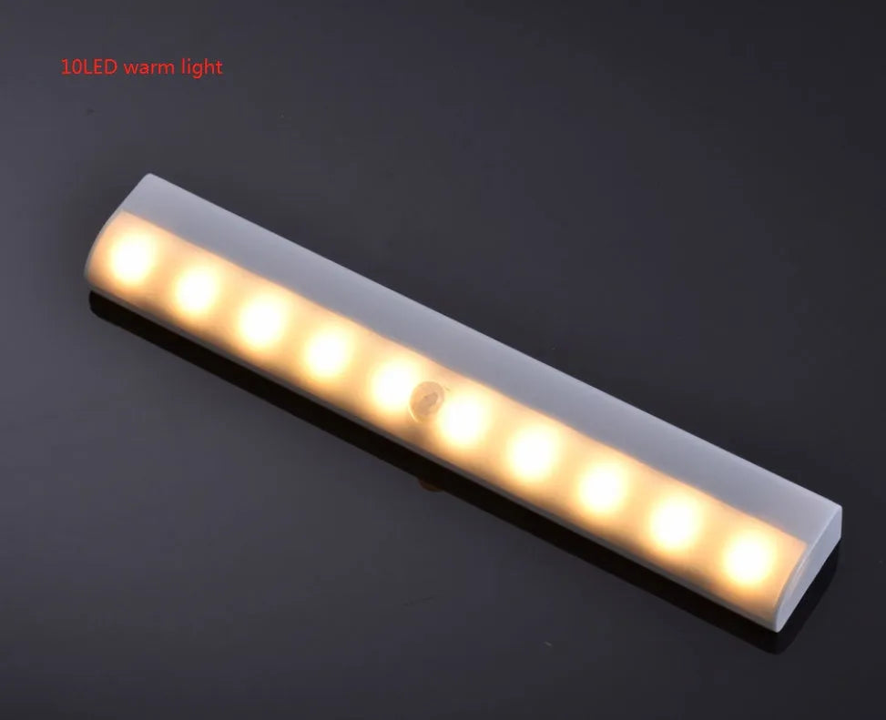 Silver aluminium magnetic LED closet light with motion sensor and USB charging port.
